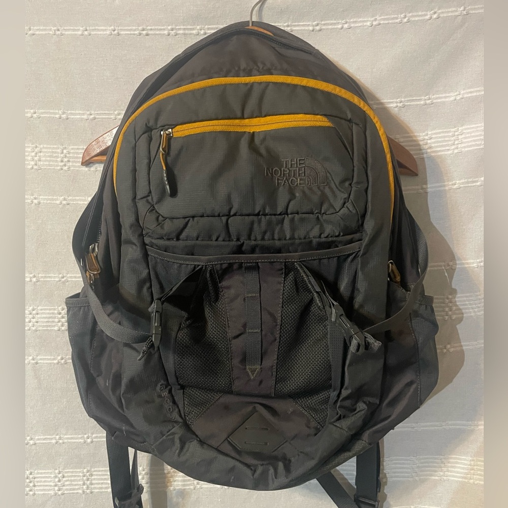 The North Face Dark Gray Backpack with Yellow Accent